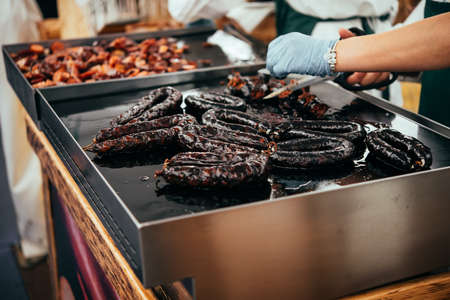 Traditional Portuguese sausages grilled at one the street markets of Lisbon, Portugal.の写真素材