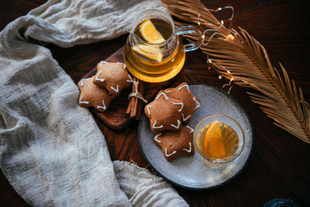 Hot beverages tea or mulled white wine served with gingerbread. Christmas celebration concept.の写真素材