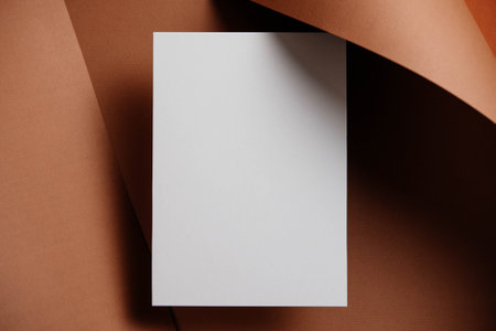 Stylish white blank paper mockup on a colorful background. Document and presentation stationery creator. Selective focus on paperの写真素材