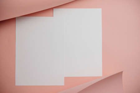 Stylish white blank paper mockup on a colorful background. Document and presentation stationery creator. Selective focus on paperの写真素材