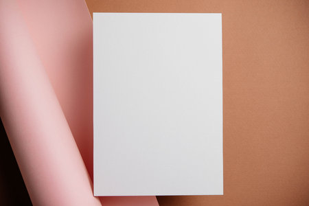 Stylish white blank paper mockup on a colorful background. Document and presentation stationery creator. Selective focus on paperの写真素材
