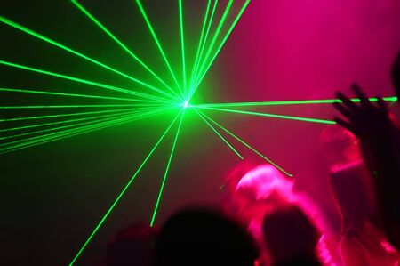 People Dancing at the Disco with laser showの写真素材