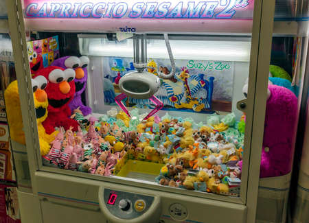 Osaka Japan - June 20, 2010  A claw crane game machine in Dotombori district on June 20, 2010 in Osaka, Japan Claw crane game machines are a frequent sight in japanese cities のeditorial素材