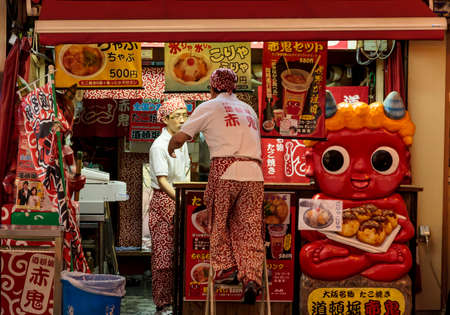 Osaka, Japan - June 20, 2010  Employees closing a street bar in Dotombori  on 20 June, 2010 in Osaka, Japan  Dotombori is the most important restaurant district and a major tourist destination in Osaka のeditorial素材