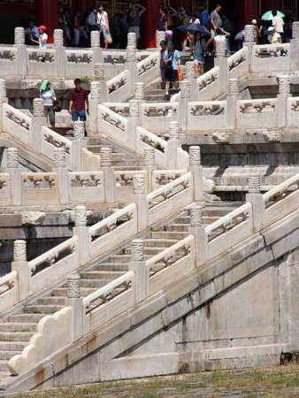 Beijing, China - August 02, 2009  Tourists walking the ornamental stairs leading to one of the main pavillons in the Forbidden City palace in Beijing on August 02, 2009 のeditorial素材