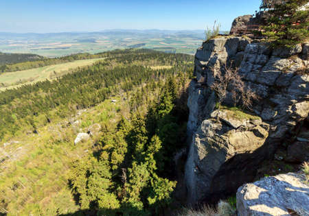 Spectacular view from top of Strzeliniec Wielki Peak, Poland with vertical rocks and large vistas of space down below の写真素材