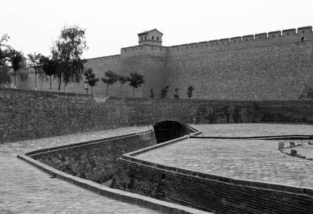 black and white; vintage style photo of the city walls and moat of Pingyao, chinaの写真素材