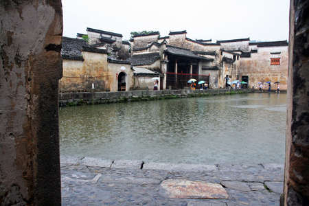 Hongcun, China - July 10, 2007   The famous moon pond in ancient Hongcun village on July 10, 2007  Hongcun is one of the most beautiful ancient towns in China のeditorial素材