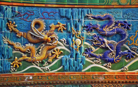 bas-reliefs of traditional chinese dragons with pearls, stylized and filtered to look like an oil...