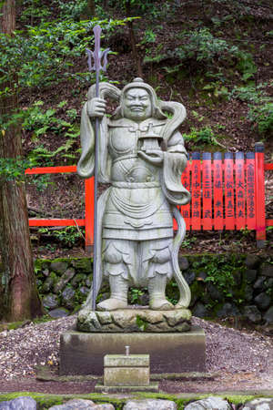 Kyoto, Japan - June 20, 2010  Stone statue of a warrior at a shinto shrine in Arashiyama district  on June 20, 2010  Arashiyama district is one of the most beautiful parts of Kyoto のeditorial素材
