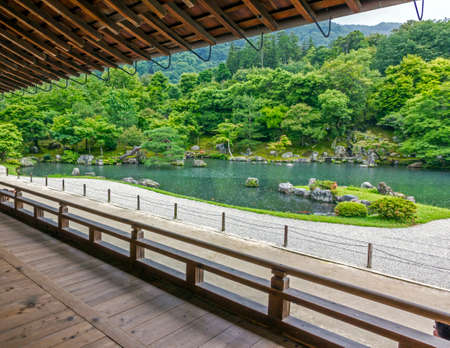 Kyoto, Japan - June 20, 2010  View to a Japanese garden with a pond from a temple in Arashiyama...