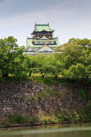 Osaka Japan - June 17, 2010  The main keep of Osaka Castle with fragments of moat on June 17, 2010 in Osaka, Japan のeditorial素材