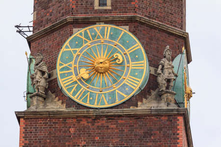 Fragment of the main tower of the city hall, Wroclaw, Poland with an old clock in the centre and...
