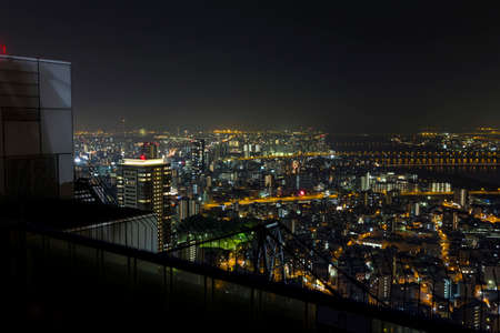 Osaka, Japan -  June 17, 2010 : Skyline of central Osaka and Yodo River with numerous bridges seen from Umeda Sky Building on June 17, 2010. Osaka is Japanのeditorial素材