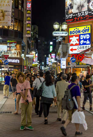 Tokyo, Japan - June 28, 2010: Crowds of people in Shibuya district in late evening on 28 June 2010. Shibuya is one of the most famous entertainment districts in Tokyo.のeditorial素材