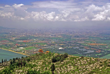 vintage style photo of aerial view of Kunming, Yunnan, China, and dian lake seen from longmen mountainsの写真素材