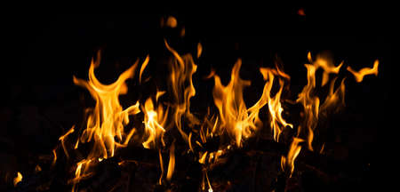 Flames are isolated on black background. Horizontal fire image. Great for burning effects.