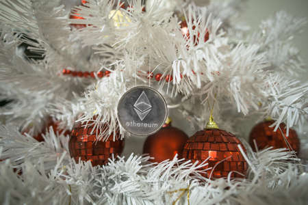 Ethereum, Monero, Bitcoin and christmas, new year silver ethereum. Cryptocurrency Ethereum on a...