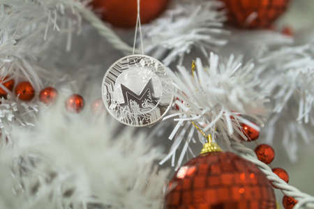 Monero and christmas, new year silver Monero. Cryptocurrency Monero on a Christmas treeの写真素材