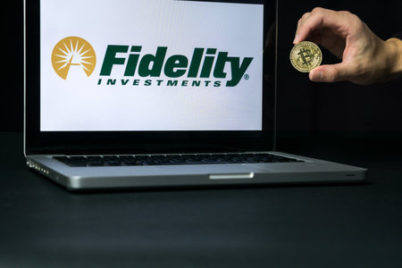 Photo for Bitcoin coin with the Fidelity logo on a laptop screen, Slovenia - December 23th, 2018 - Royalty Free Image