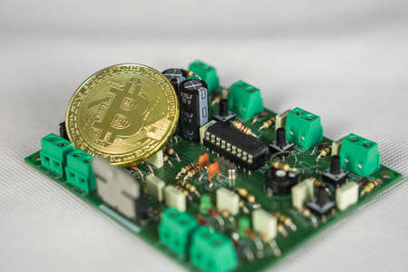 Photo of Bitcoin or Bitcoin cash on electronic circuit, computer part