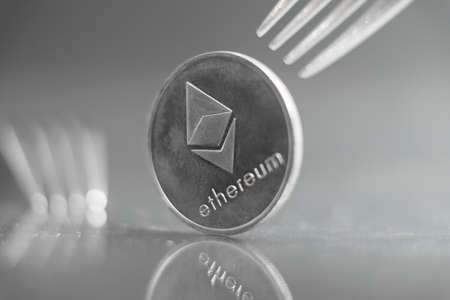 Macro photo of Ethereum cryptocurreny fork concept with reflection, hard forkの写真素材