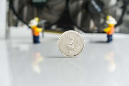 Ethereum Cryptocurrency switching from POW, GPU mining to POS, POS sign with graphic card and figures in the backgroundの写真素材