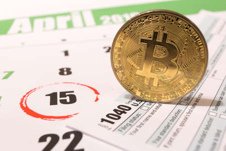 2019 calendar with 1040 income tax form for 2018 showing tax day for filing on April 15の写真素材