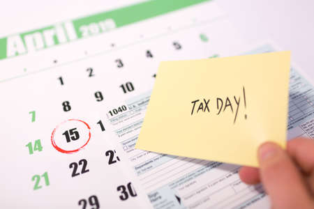 2019 calendar with 1040 income tax form for 2018 showing tax day for filing on April 15