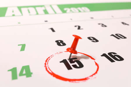 2019 calendar with 1040 income tax form for 2018 showing tax day for filing on April 15の写真素材