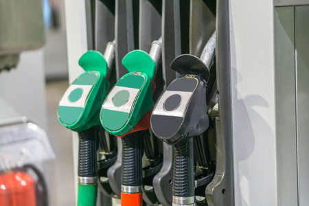 Colorful Petrol pump filling nozzles , Gas station in a serviceの写真素材