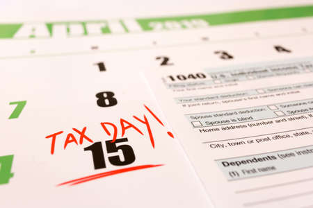 2019 calendar with 1040 income tax form for 2018 showing tax day for filing on April 15の写真素材
