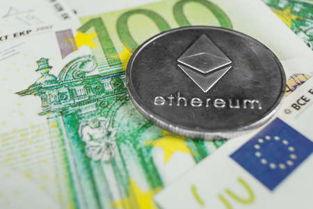 Crypto currency concept - A Ethereum with euro billsの写真素材