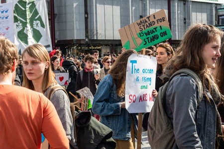 Slovenia, Ljubljana 15.03.2019 - Young protestors with banners at a Youth strike for climate marchのeditorial素材