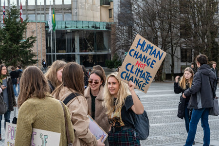 Slovenia, Ljubljana 15.03.2019 - Young protestors with banners at a Youth strike for climate marchのeditorial素材