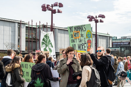 Slovenia, Ljubljana 15.03.2019 - Young protestors with banners at a Youth strike for climate marchのeditorial素材