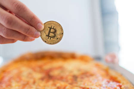 Bitcoin pizza day anniversary. The first reported exchange of cryptocurrency for a consumer product on May 22, 2010.の写真素材