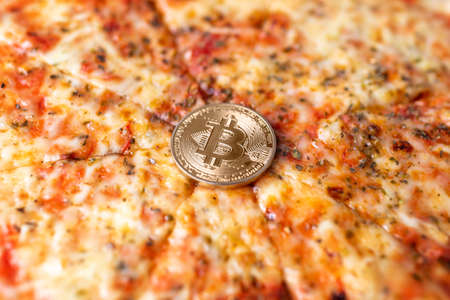 Bitcoin pizza day anniversary. The first reported exchange of cryptocurrency for a consumer product on May 22, 2010.の写真素材