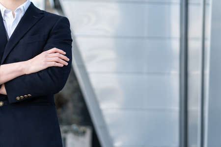 business man in classic black suit, shirt holding hands folded Achievement career wealth business concept. copy spaceの写真素材