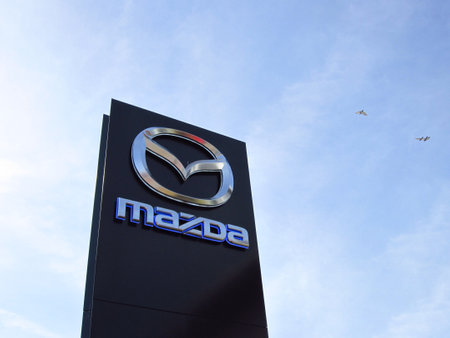 LJUBLJANA, SLOVENIA - MARCH 22 2019: Brand logo at the entrance to Mazda dealership. Mazda is a Japanese multinational car manufacturer.のeditorial素材