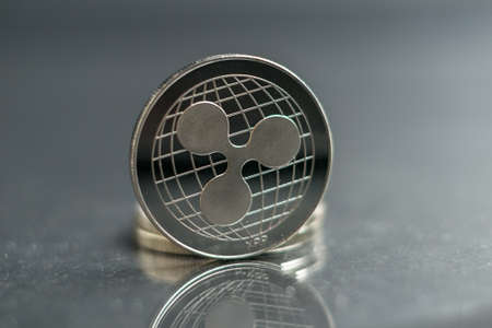 Ripple. xrp Crypto currency silver coin, Macro shot of ripple coin isolated on background, cut out Blockchain technology,の写真素材