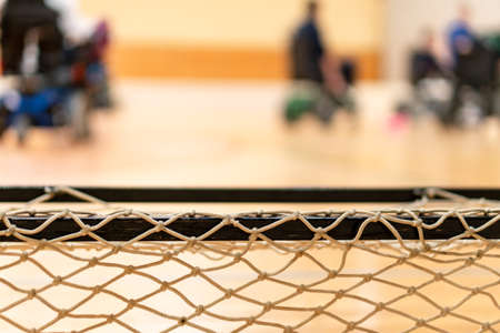 Disabled people in blur on an electric wheelchair playing sports, powerchair hockey. IWAS - International wheelchair and amputee sports federationの写真素材