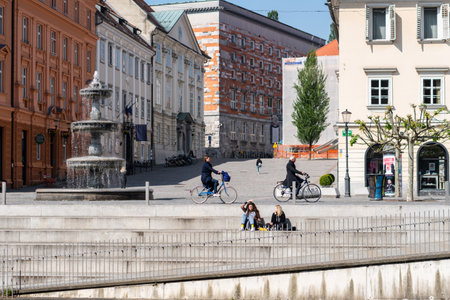 Ljubljana, Slovenia 7.5.2019 Beautiful street in Ljubljana old town Slovenia. People driving on bicyclesのeditorial素材