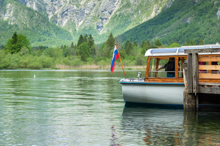 SLOVENIA, BOHINJ: 26. May 2019: Colorful panorama of the Bohinj Lake at Ukanc. Picturesque moning in the Triglav National Park, Julian Alps.のeditorial素材