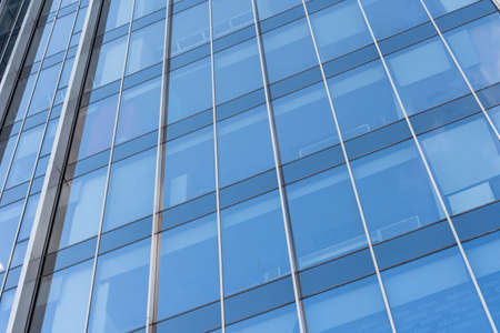 closeup of a modern window glass building reflecting