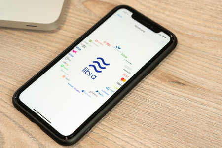 18 June 2019, Ljubljana Slovenia - smartphone with Libra logo and its partners on it. Facebooks new...
