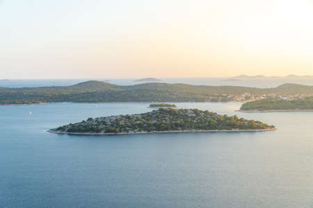 Islands on sea with sun flare - Kornati National Park Croatiaの写真素材