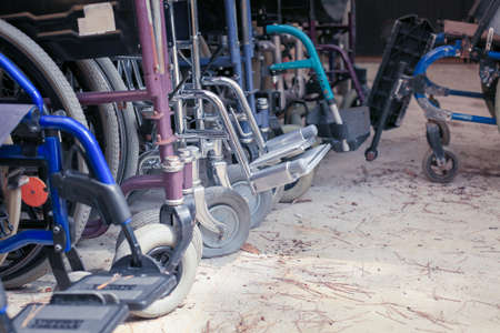 Bunch of empty wheelchairs parked in hospital
