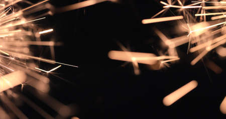 Burning firework sparks on black background, happy Christmas and New year celebrationの写真素材