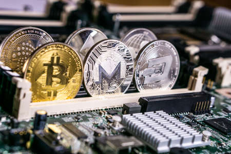 Golden Bitcoin and altcoins Monero and dash Cryptocurrency on computer circuit board. Blockchain and security conceptの写真素材